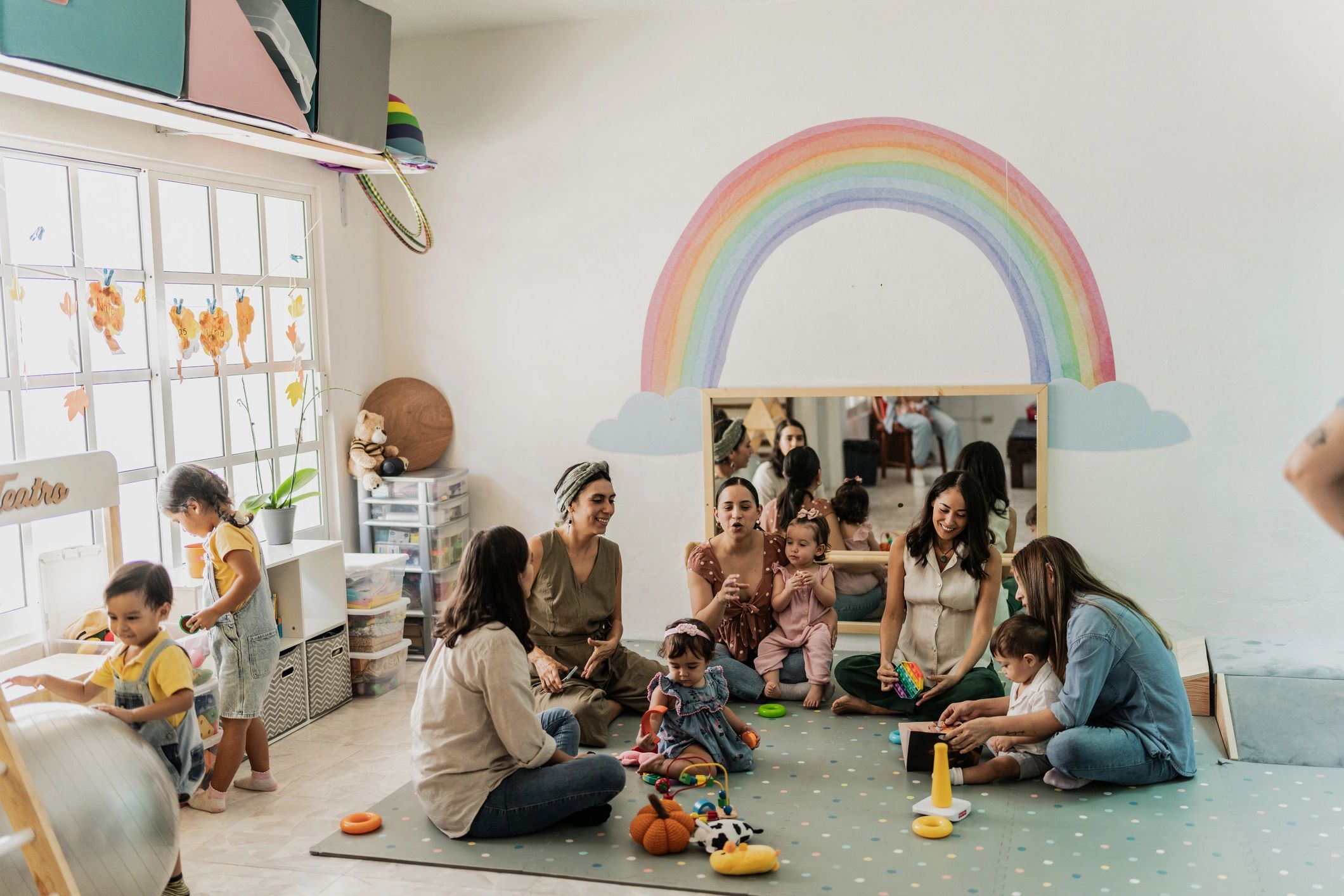 Parents talking together in a playroom