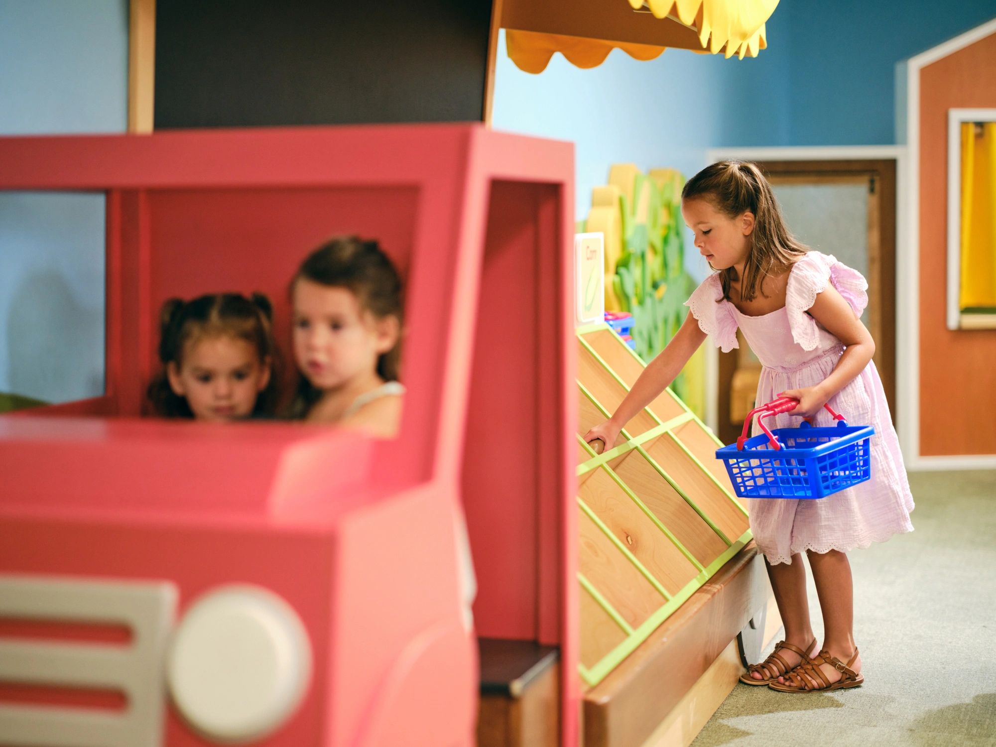 Children playing indoors with toys