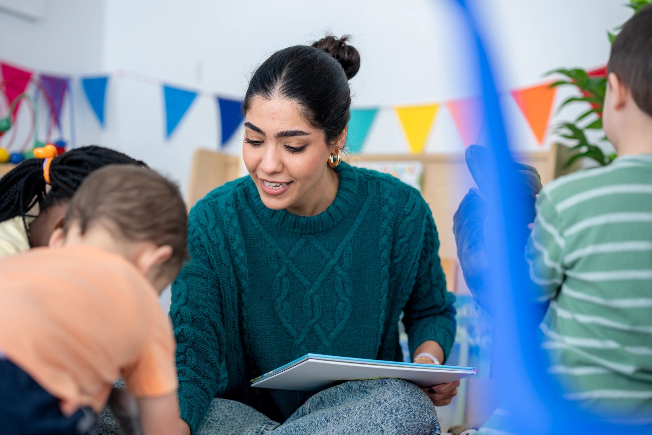 Teacher reading with children during circle time